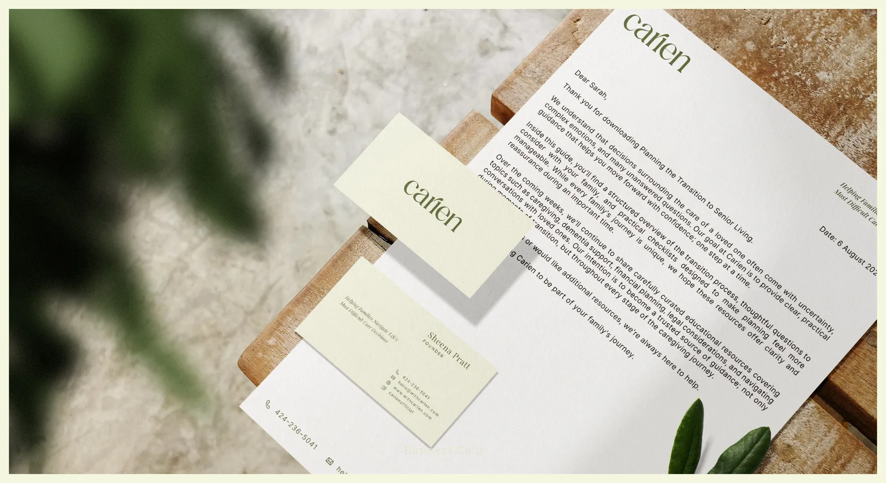 Carien business card and letterhead design photographed on a warm neutral surface